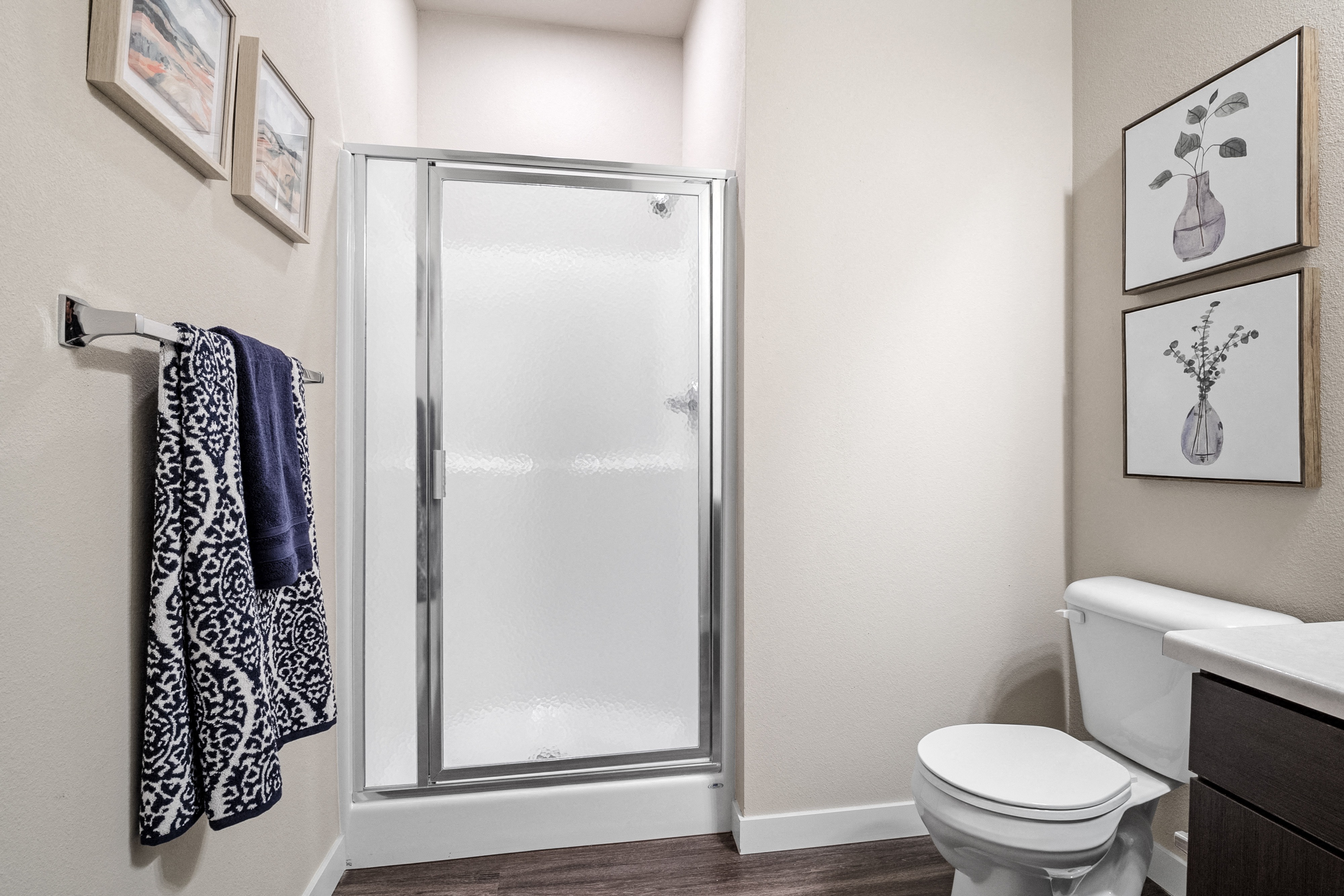 a bathroom with a shower and a toilet and a sink  at Aventura at Wentzville, Wentzville, 63385